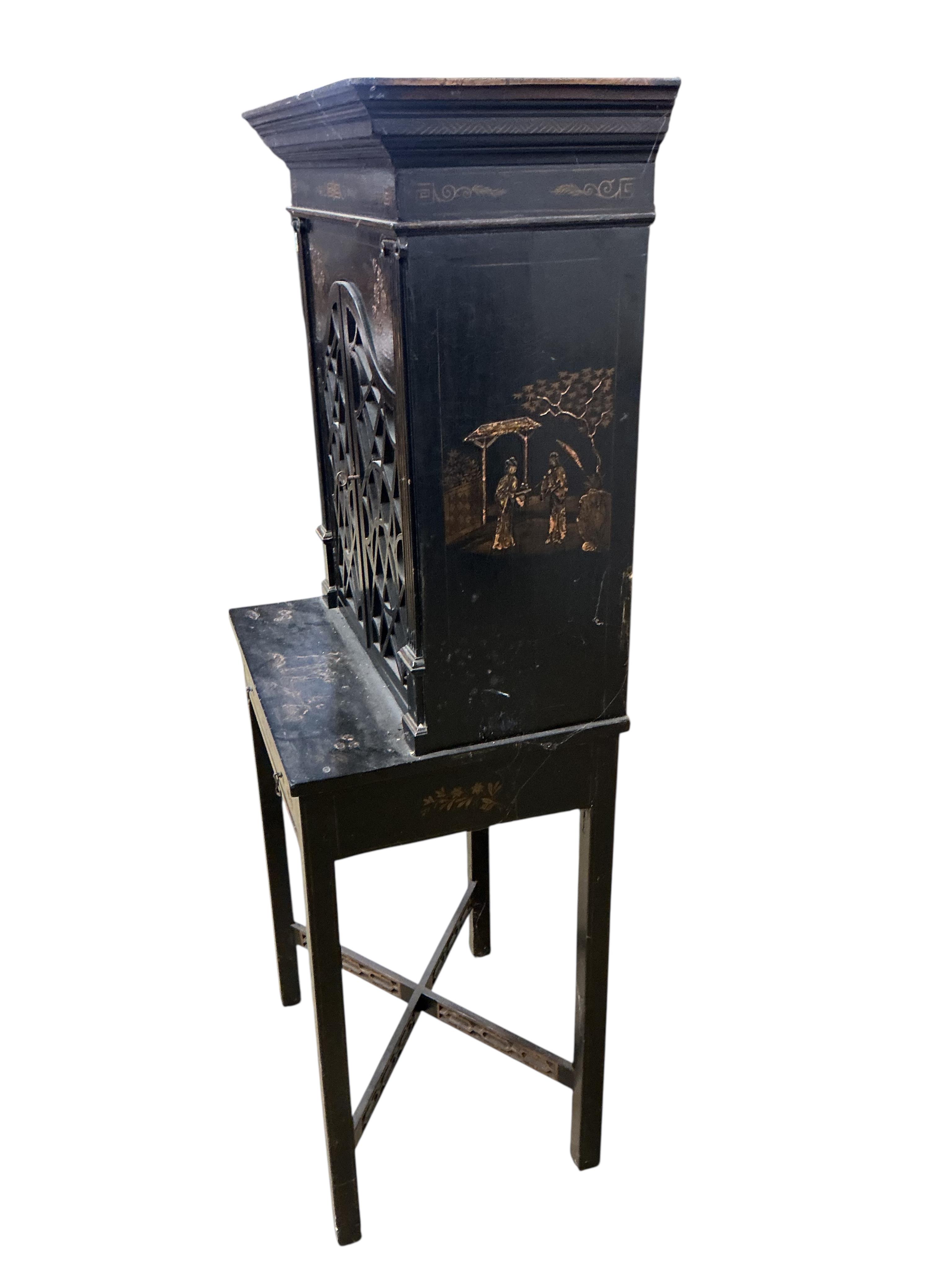 A chinoiserie lacquer cabinet on stand, width 63cm, depth 31cm, height 147cm